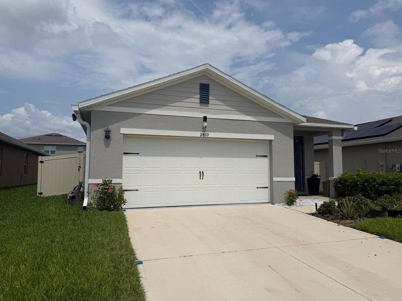 Front exterior of a new home in Concorde, Sanford, FL, highlighting curb appeal (Image 2). Front exterior of a new home in Concorde, Sanford, FL, highlighting curb appeal (Image 2).