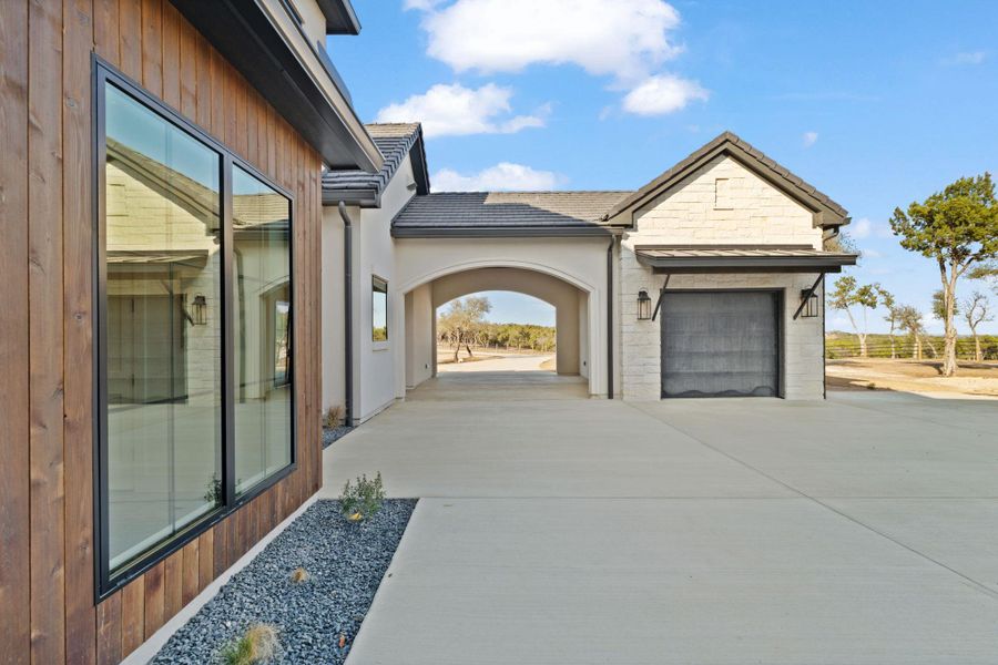 Additional view of motor court with porte-cochere and 1 car garage.