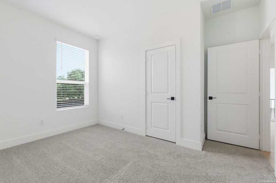 Spacious, unfurnished interior of a new home in Centero at Stone Oak, San Antonio (Image 20).