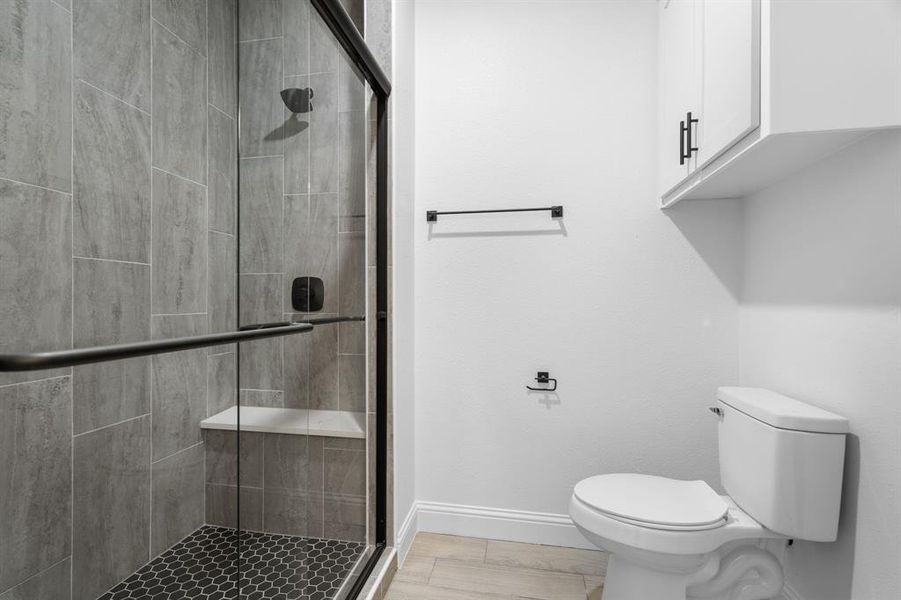 Bathroom with walk in shower and toilet