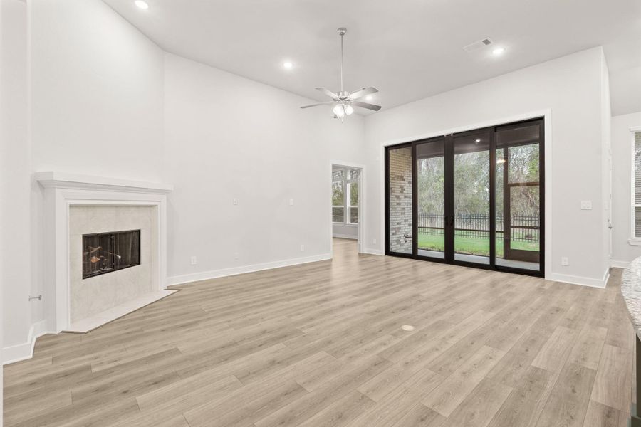 Stone fireplace with glass encased ceramic gas logs