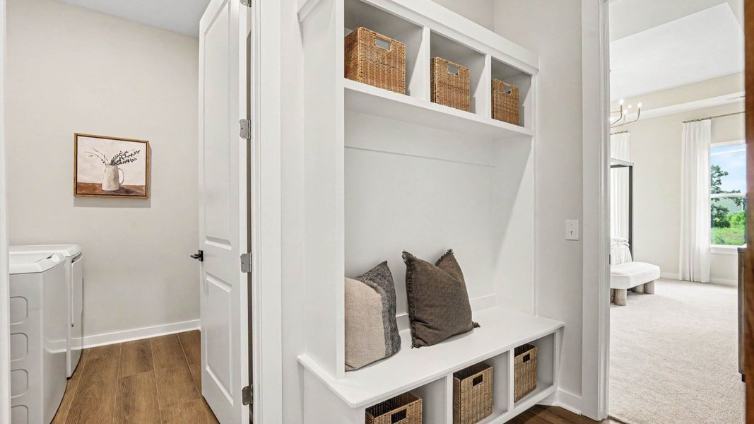 Dedicated drop-zone with access to dedicated laundry room and primary suite
