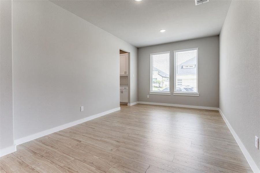 Spare room with light wood-type flooring