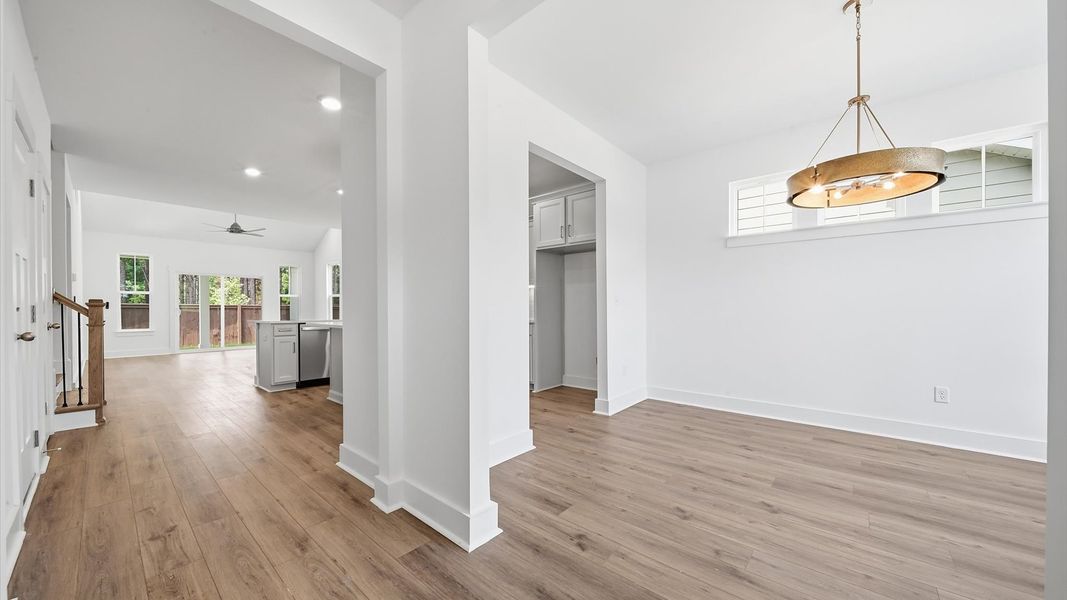 Superior design begins at the front door with a hardwood floor foyer and elegant sightlines Superior design begins at the front door with a hardwood floor foyer and elegant sightlines