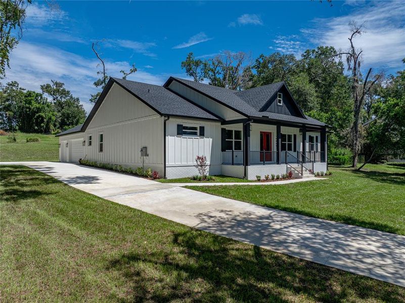 Front exterior of a new home in , Dade City, FL, highlighting curb appeal (Image 24). Front exterior of a new home in , Dade City, FL, highlighting curb appeal (Image 24).