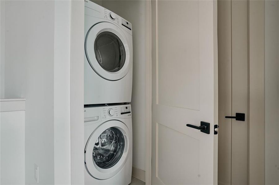 Stackable laundry appliances with flat-panel doors and matte black hardware