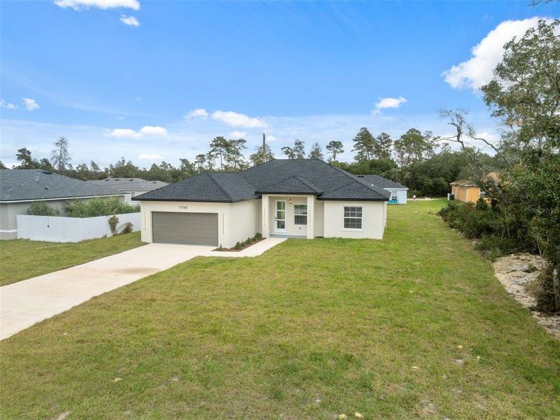 Front exterior of a new home in , Ocala, FL, highlighting curb appeal (Image 20).
