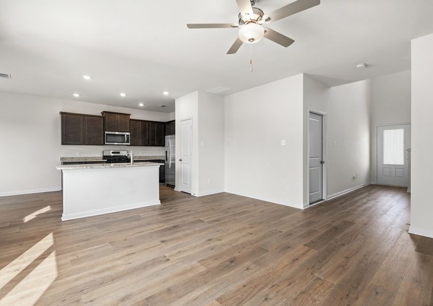 The living room is spacious and has plenty of room for furniture.