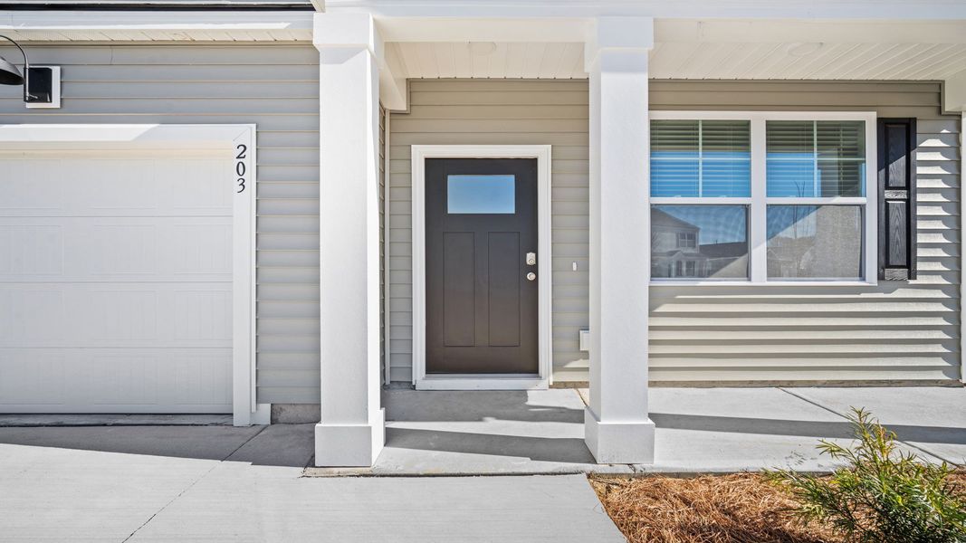 Front exterior of a new home in Rice Hope, Port Wentworth, GA, highlighting curb appeal (Image 2).