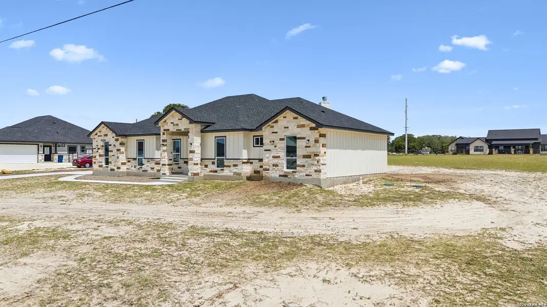 Front exterior of a new home in , La Vernia, TX, highlighting curb appeal (Image 26). Front exterior of a new home in , La Vernia, TX, highlighting curb appeal (Image 26).