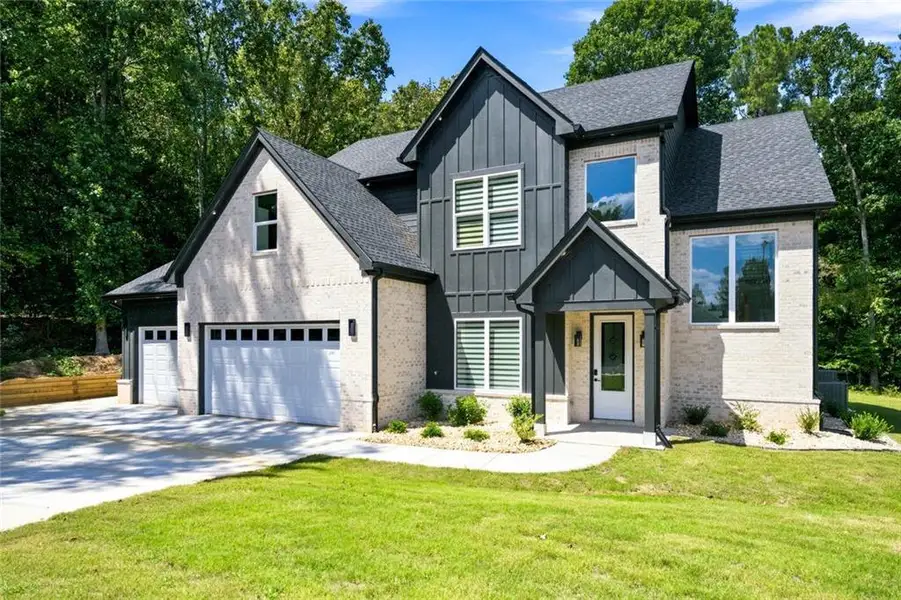 Front exterior of a new home in , Monroe, GA, highlighting curb appeal (Image 1). Front exterior of a new home in , Monroe, GA, highlighting curb appeal (Image 1).