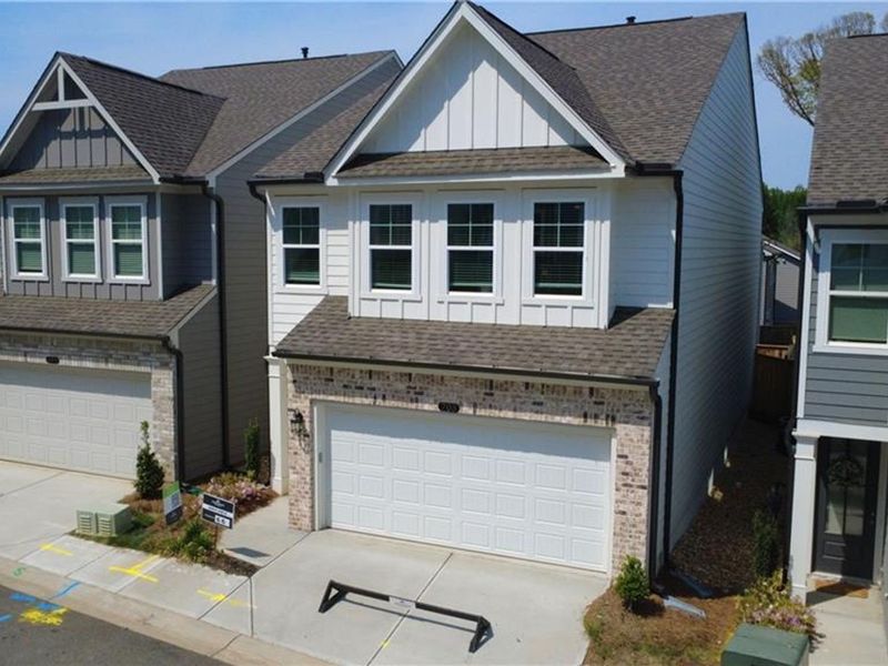 Front exterior of a new home in The Village at Shallowford, Kennesaw, GA, highlighting curb appeal (Image 18).