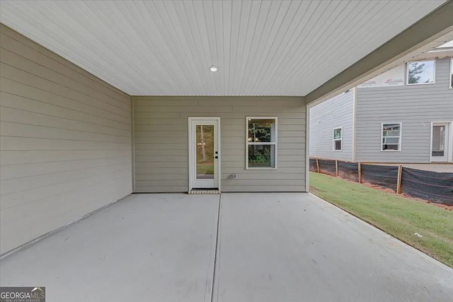 Exterior details and patio area of a home in Canterbury Villas, Carrollton (Image 3).