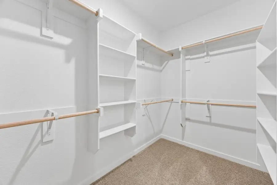 Primary Closet in the Cedar home plan by Trophy Signature Homes – REPRESENTATIVE PHOTO Primary Closet in the Cedar home plan by Trophy Signature Homes – REPRESENTATIVE PHOTO