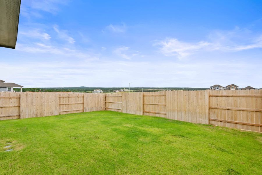 Exterior details and patio area of a home in Lariat, Liberty Hill (Image 29).