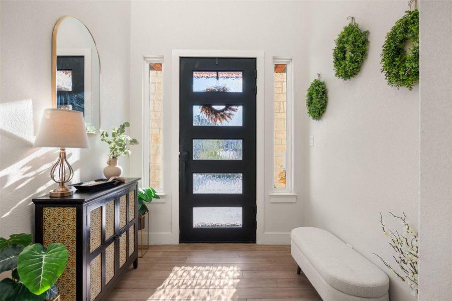 Foyer featuring light wood-type flooring Foyer featuring light wood-type flooring