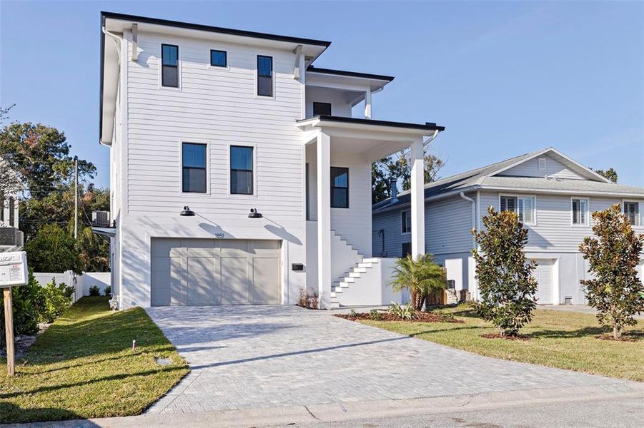 Front exterior of a new home in , St. Petersburg, FL, highlighting curb appeal (Image 23).