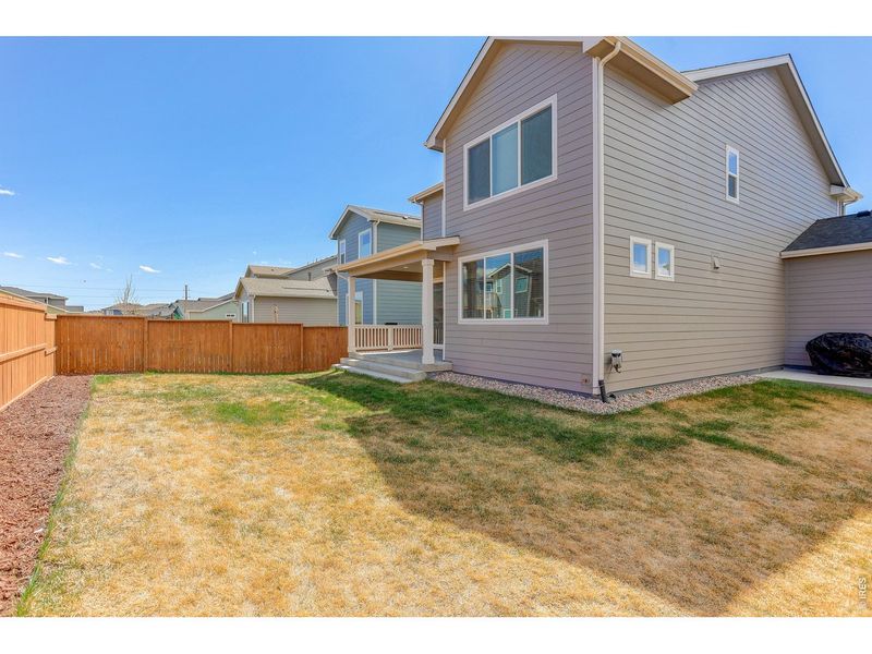 Exterior details and patio area of a home in Mountain Brook, Longmont (Image 4).