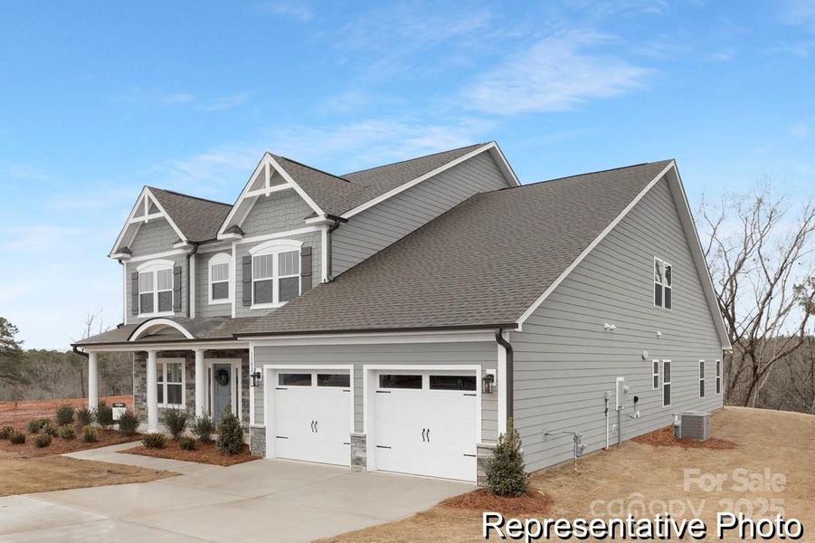 Front exterior of a new home in Heritage Hall, Statesville, NC, highlighting curb appeal (Image 2). Front exterior of a new home in Heritage Hall, Statesville, NC, highlighting curb appeal (Image 2).