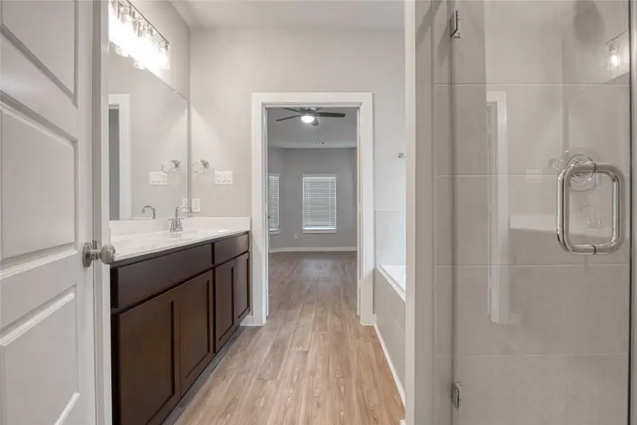 The shower is on the right and toilet behind the door on the left. The shower is on the right and toilet behind the door on the left.