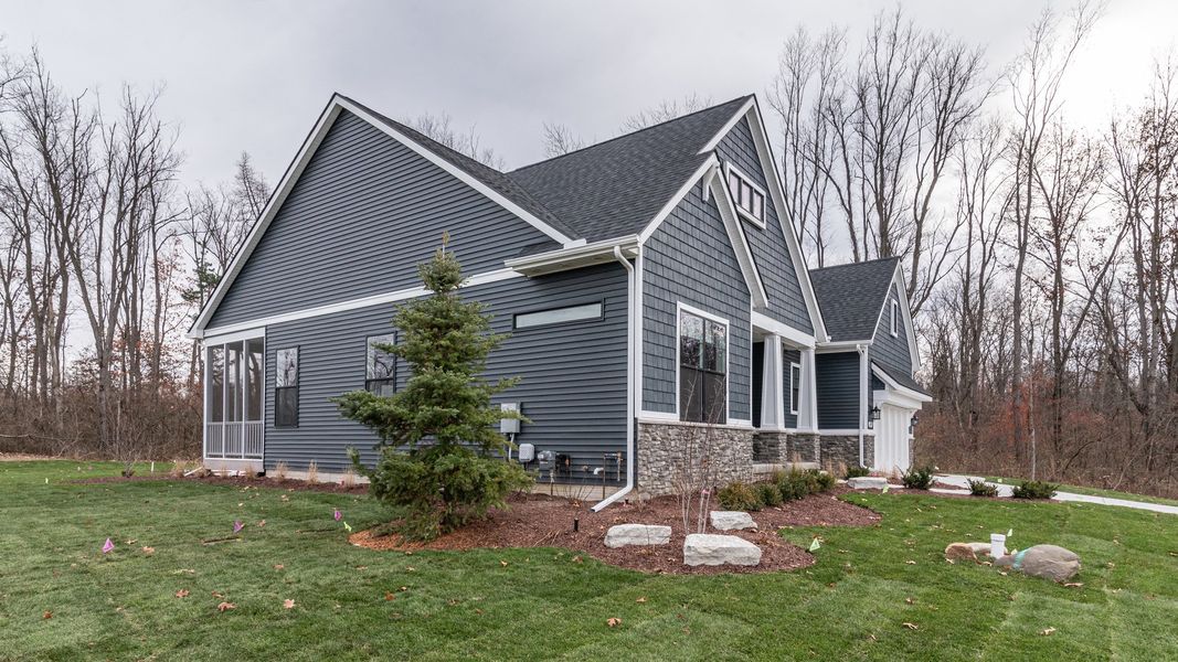Front exterior of a new home in Preserve at Magnolia Park, Jackson, MI, highlighting curb appeal (Image 26).