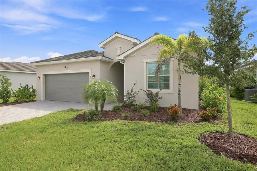 Front exterior of a new home in , Venice, FL, highlighting curb appeal (Image 24).
