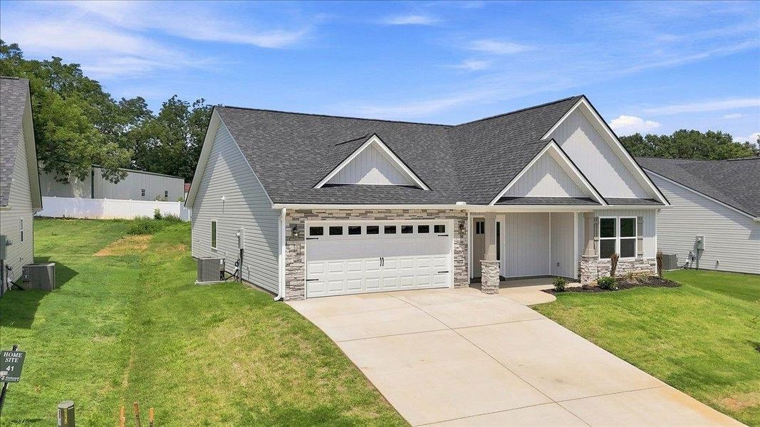Front exterior of a new home in Davis Heights, Inman, SC, highlighting curb appeal (Image 21). Front exterior of a new home in Davis Heights, Inman, SC, highlighting curb appeal (Image 21).