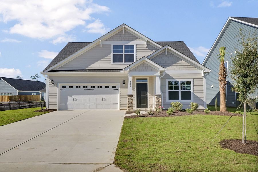 Front exterior of a new home in Grand Park, Leland, NC, highlighting curb appeal (Image 1).