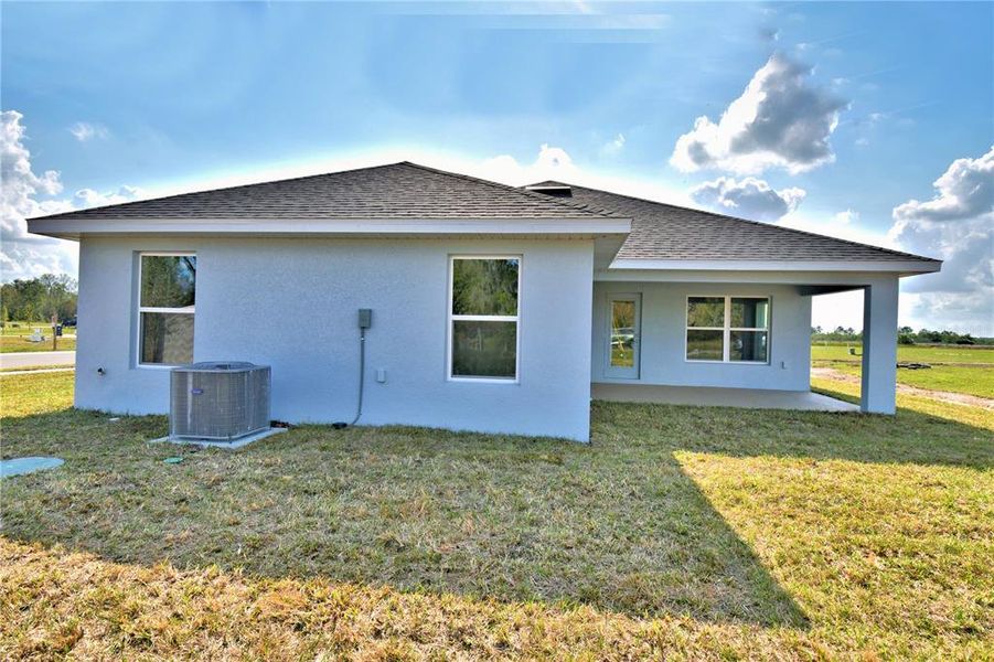 Exterior details and patio area of a home in Cadence Crossing, Auburndale (Image 4).