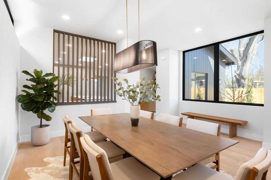 Dining area with recessed lighting, baseboards, and light wood-style flooring