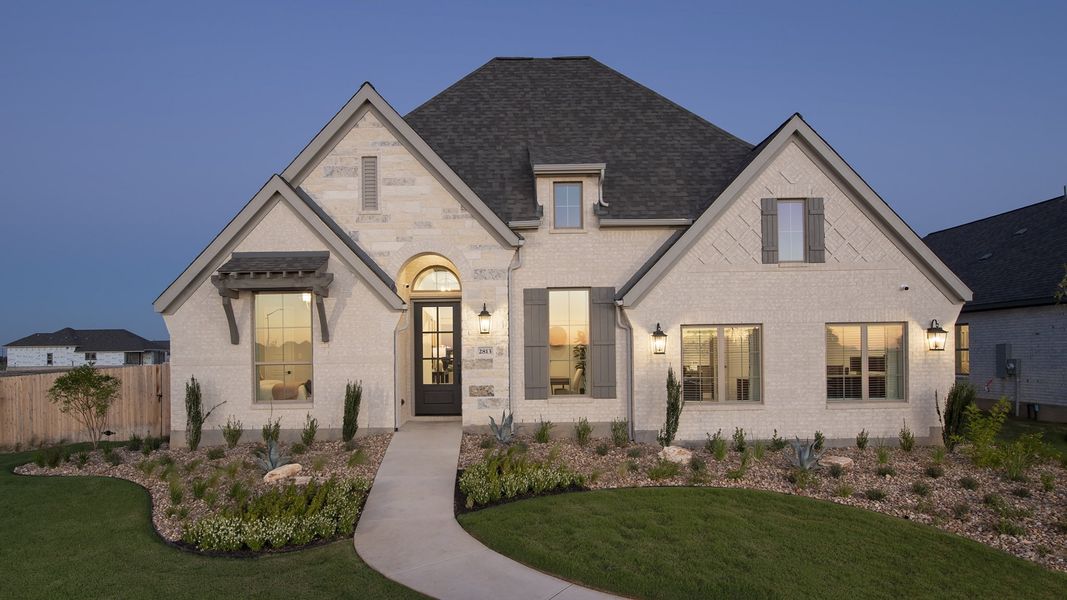 Front exterior of a new home in Trinity Falls, McKinney, TX, highlighting curb appeal (Image 21).