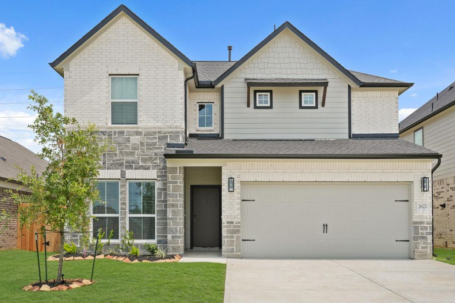 Front exterior of a new home in Morton Creek Ranch, Katy, TX, highlighting curb appeal (Image 12). Front exterior of a new home in Morton Creek Ranch, Katy, TX, highlighting curb appeal (Image 12).