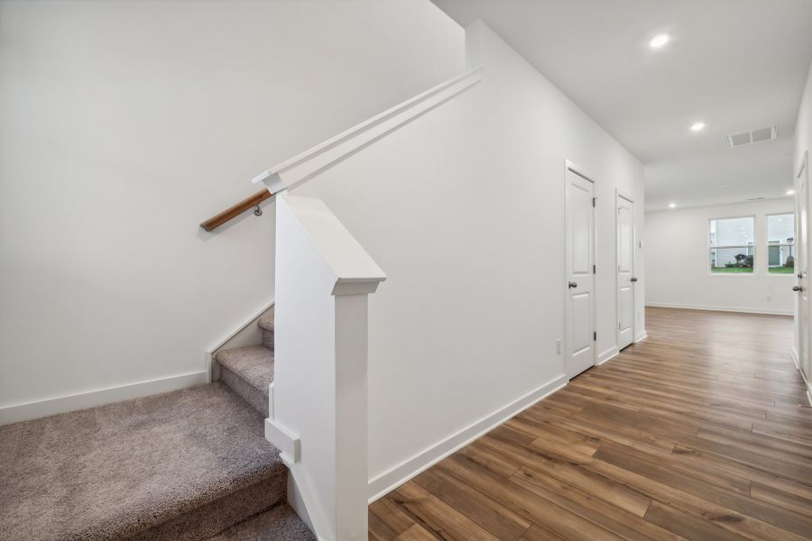 A white staircase in a room. A white staircase in a room.