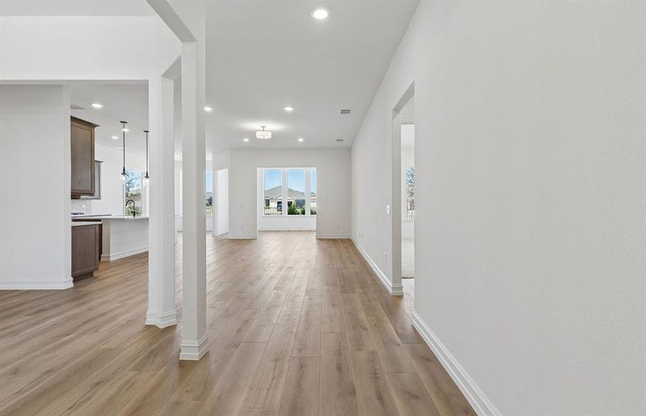 Welcoming entry into home with view of main living areas