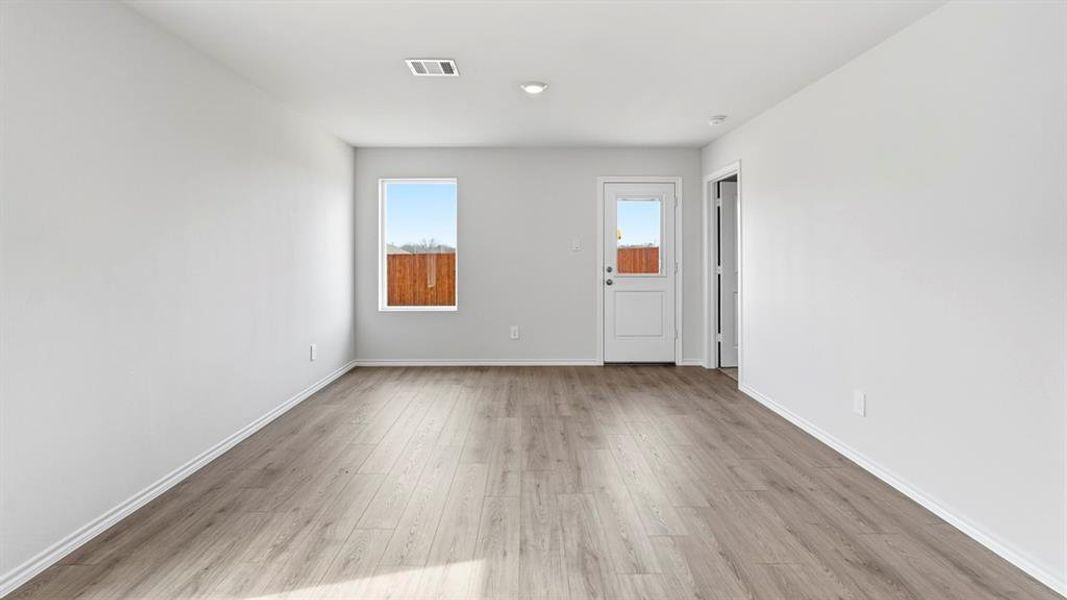 Empty room featuring light wood-style floors and baseboards