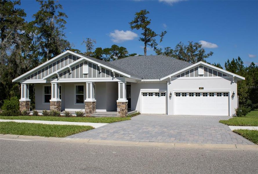 Front exterior of a new home in Southern Hills Plantation, Brooksville, FL, highlighting curb appeal (Image 2). Front exterior of a new home in Southern Hills Plantation, Brooksville, FL, highlighting curb appeal (Image 2).