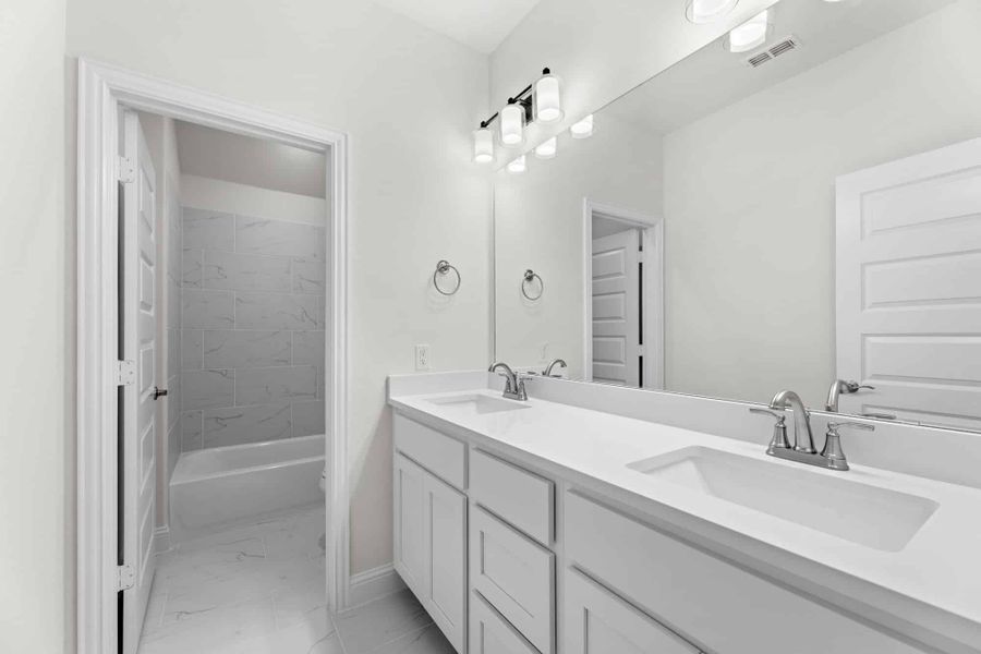 Representative furnished interior of a home built from the Willow by UnionMain Homes in Edgewater, Fate (Image 10).