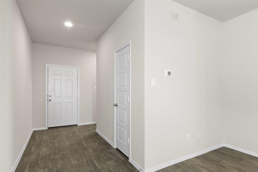 Hall with dark wood finished floors and recessed lighting Hall with dark wood finished floors and recessed lighting