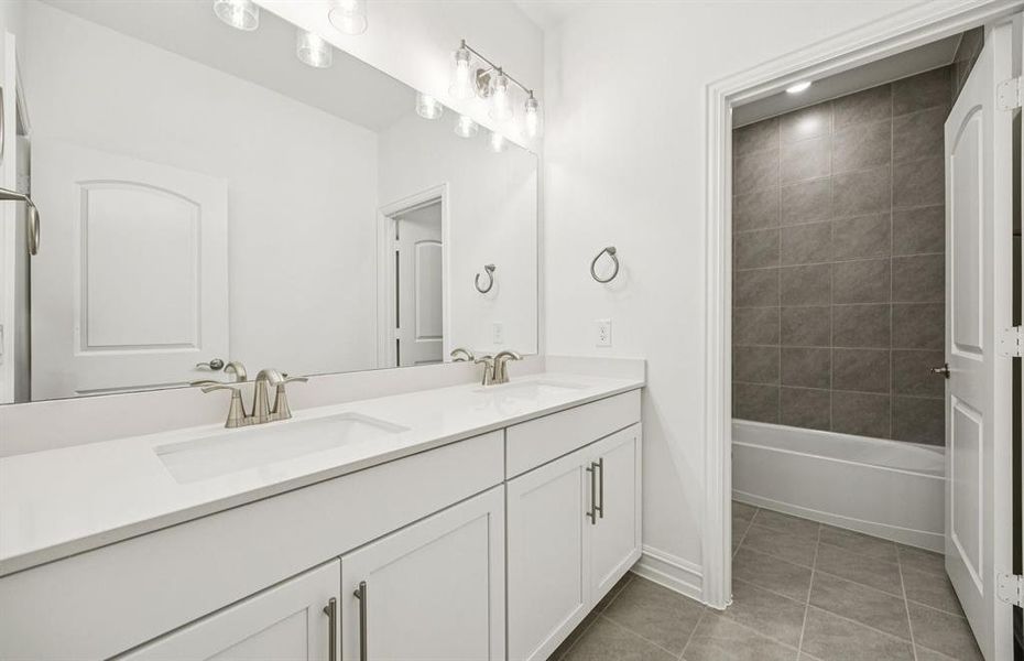 Spacious secondary bathroom with double sinks Spacious secondary bathroom with double sinks