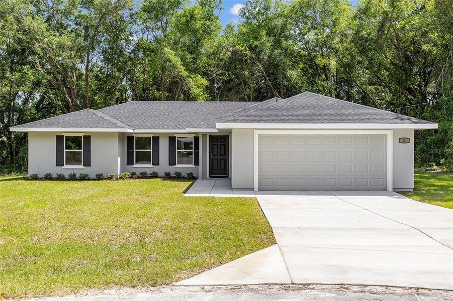 Front exterior of a new home in , Ocala, FL, highlighting curb appeal (Image 23).