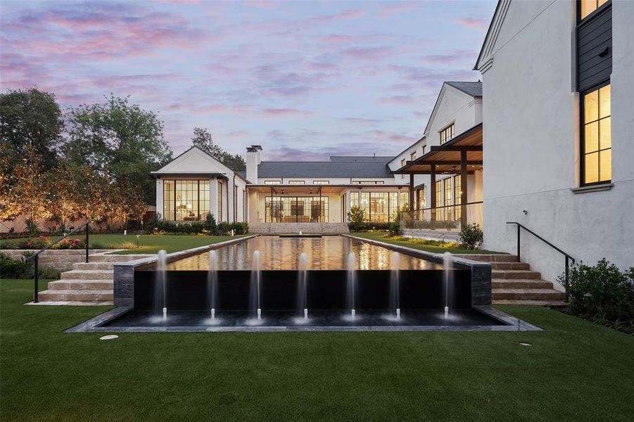 Infinity edge pool with water feature
