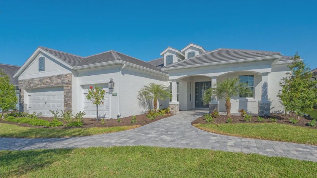 Representative exterior photo of a completed home built from the Captiva by Neal Communities in Grand Palm, Venice, FL (Image 2). Representative exterior photo of a completed home built from the Captiva by Neal Communities in Grand Palm, Venice, FL (Image 2).