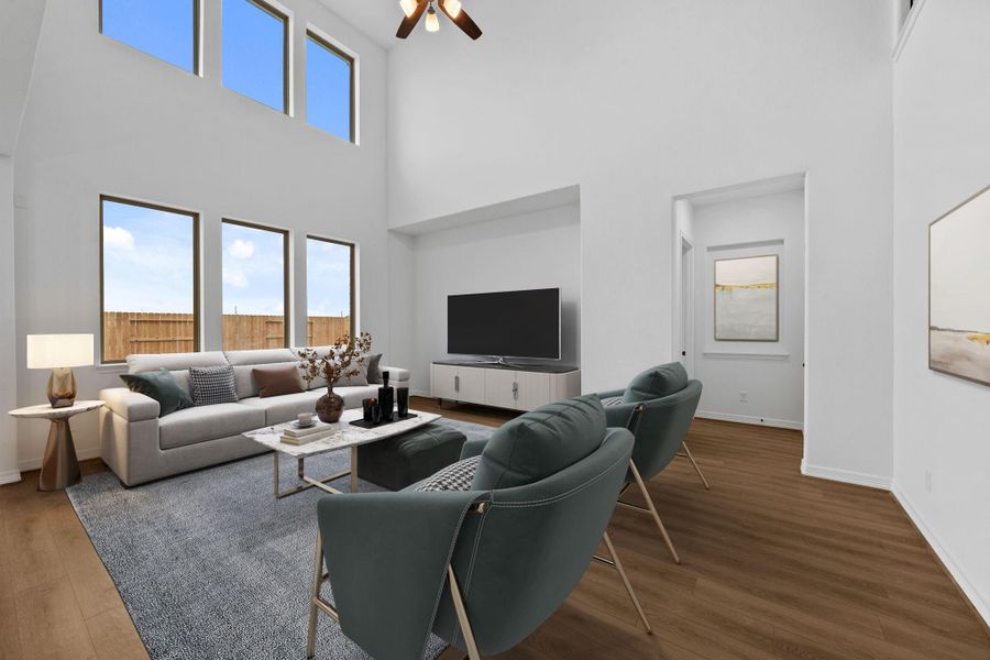 The family room invites connection with an open layout, soft textures, and relaxed sophistication.