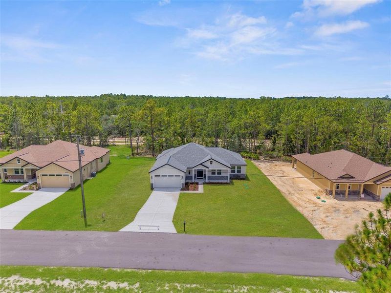 Front exterior of a new home in , Weeki Wachee, FL, highlighting curb appeal (Image 32).
