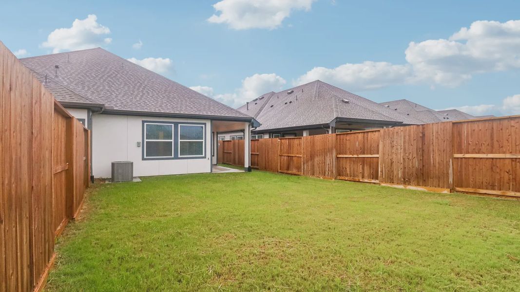 Exterior details and patio area of a home in Meridiana Townhomes, Manvel (Image 28).