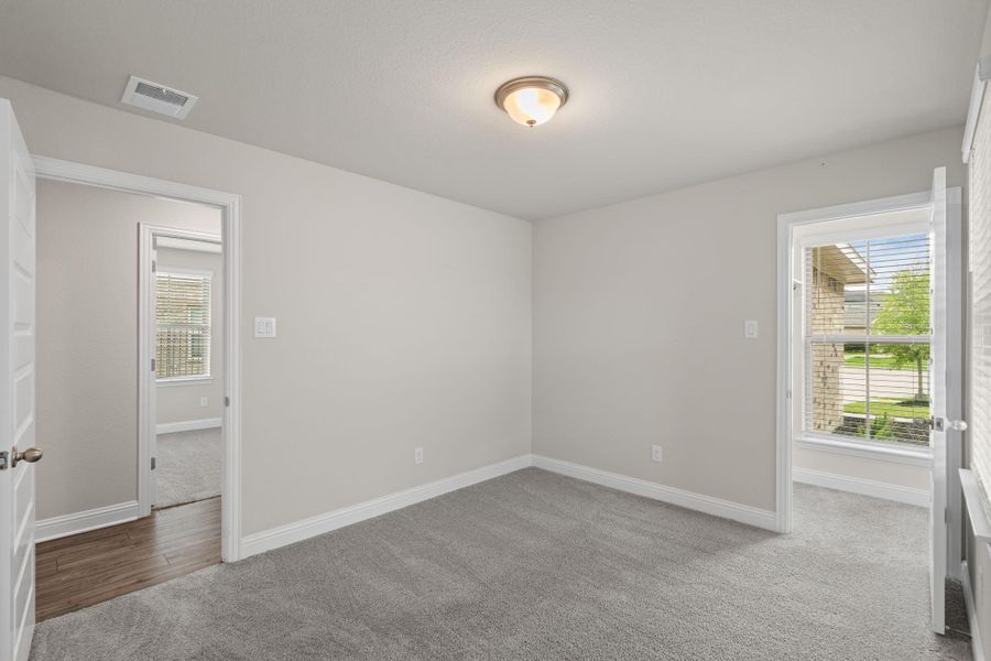 Spacious, unfurnished interior of a new home in Sunterra, Katy (Image 24).