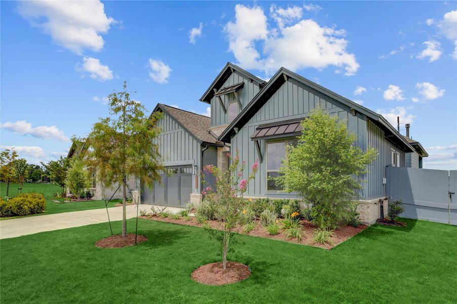 Front exterior of a new home in Fulshear Lakes Gardens, Fulshear, TX, highlighting curb appeal (Image 24). Front exterior of a new home in Fulshear Lakes Gardens, Fulshear, TX, highlighting curb appeal (Image 24).