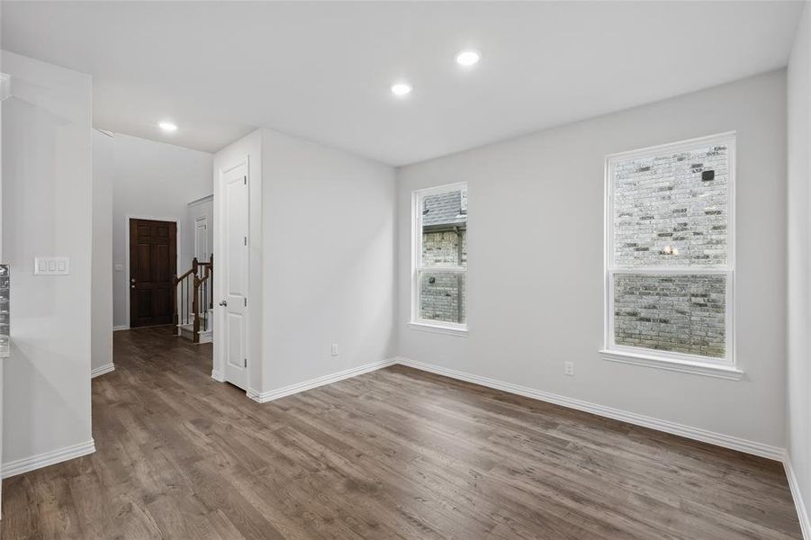 Unfurnished room featuring wood finished floors and recessed lighting