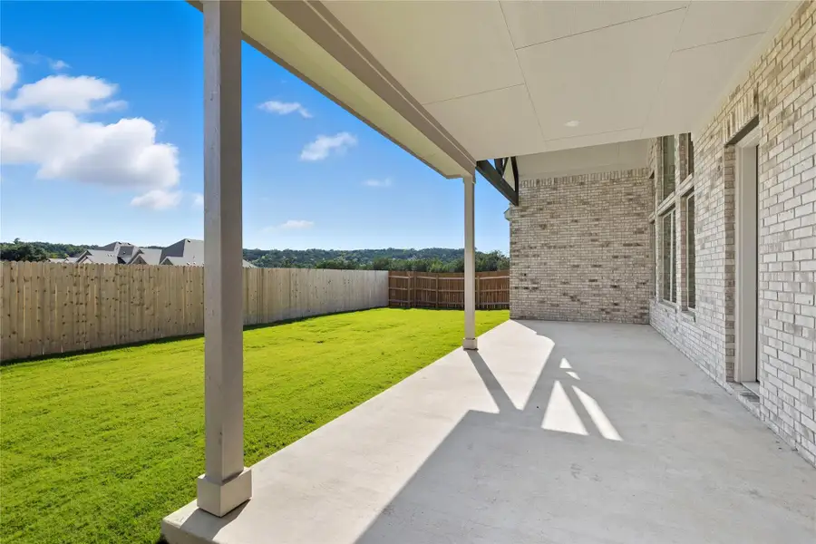Fenced backyard with a patio Fenced backyard with a patio