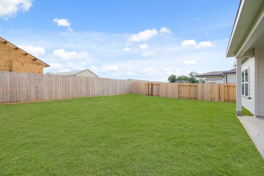 Front exterior of a new home in Sherwood Glen, Conroe, TX, highlighting curb appeal (Image 2).